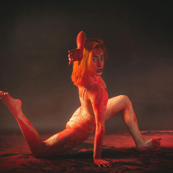 Person in a fluid yoga movement, feeling energetic and flexible.